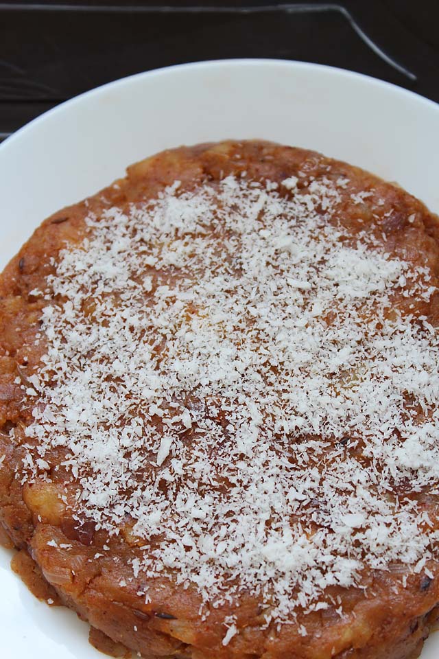 grated coconut sprinkled on cooked potato filling. 