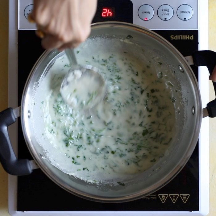 stirring methi matar mixture.