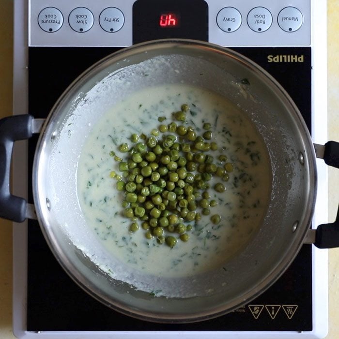 matar (green peas) added to curry.