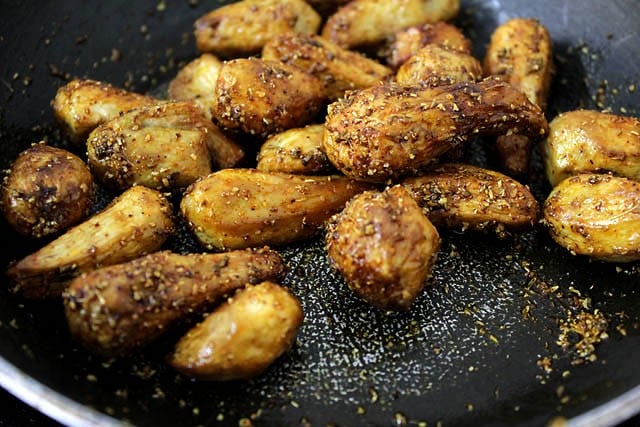 fried arbi added to the spice mixture and tossed uniformly. 
