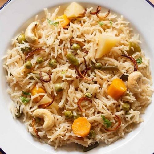 yakhni pulao on a white plate