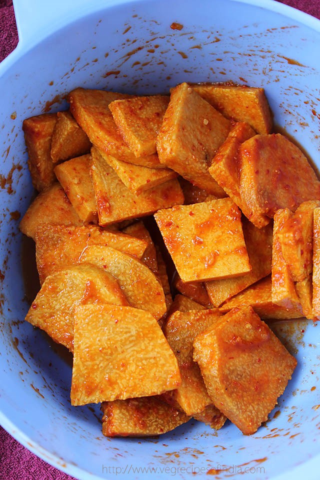 marinated yam slices in a bowl. 