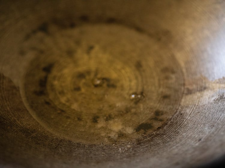 asafoetida in oil in a kadai