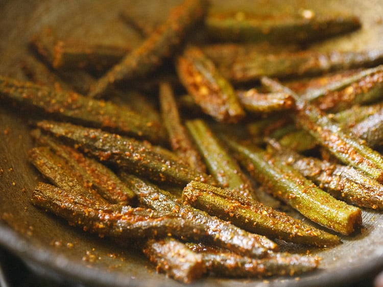 slow cooking bharwa bhindi in the pan.