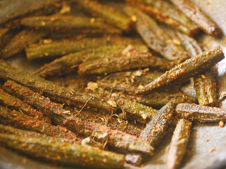 crushed dried fenugreek leaves and garam masala powder added to bharwa bhindi.