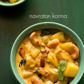 navratan korma served in a green bowl