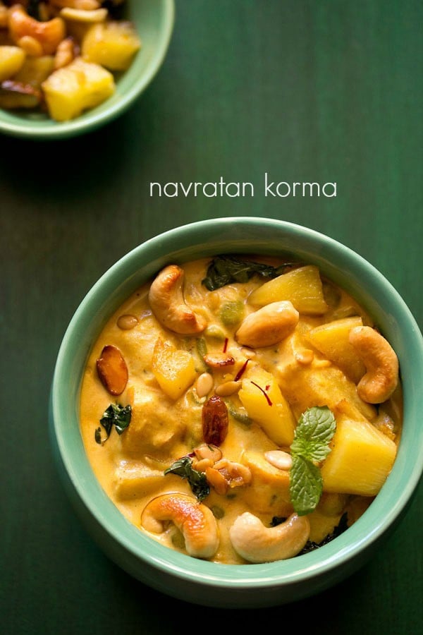 navratan korma served in a green bowl