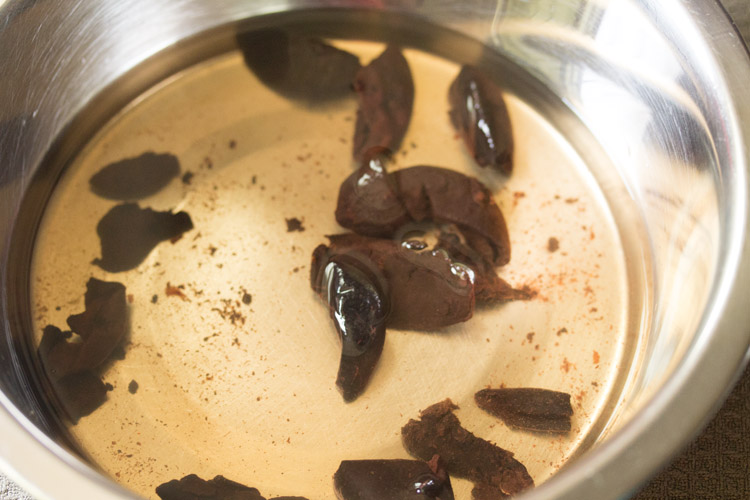 soaking kokums in water for making solkadhi.