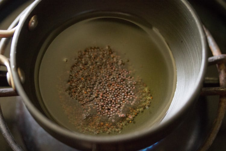 mustard seeds added to oil.