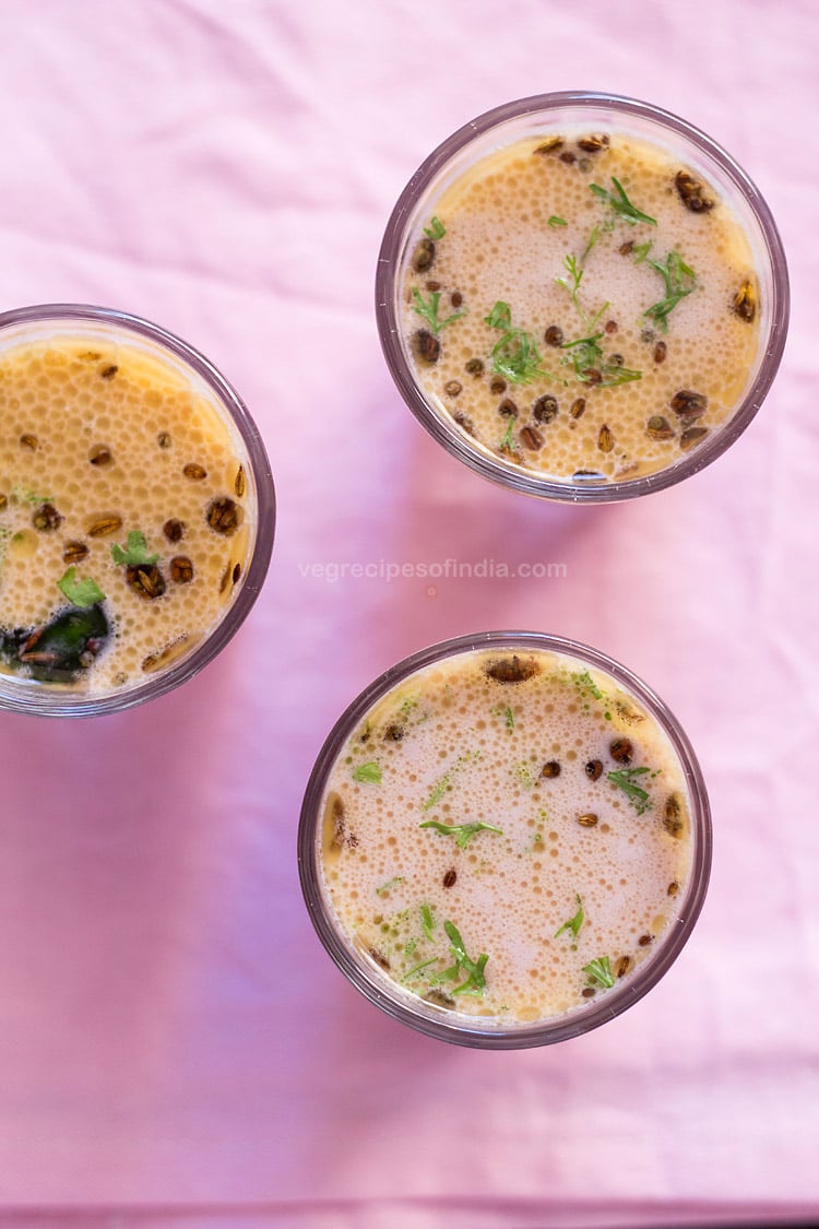 overhead shot of 3 glasses of solkadhi on a pink background.