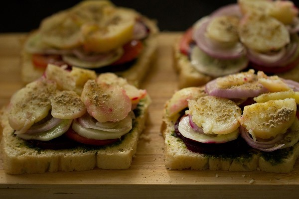 Bombay sandwich with chutney, beetroot, tomatoes, cucumber, onions, potatoes and seasoning.