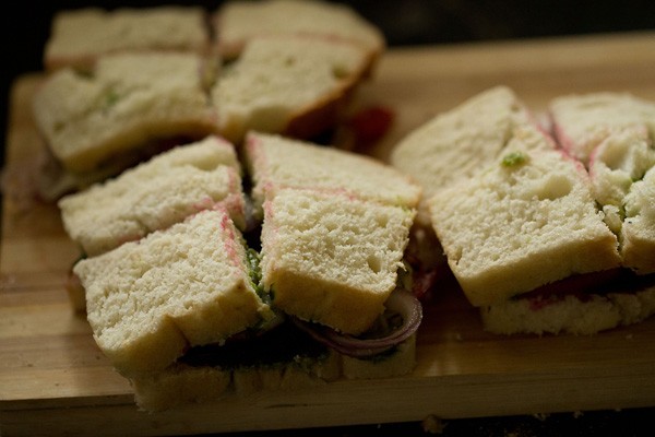 veg sandwich sliced into four