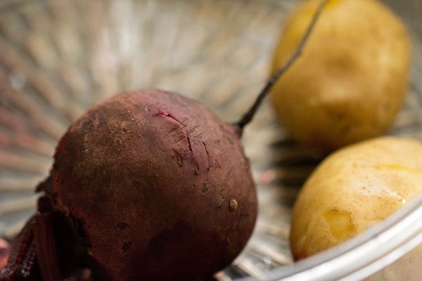 beetroot and potatoes in a steamer for bombay sandwich. 