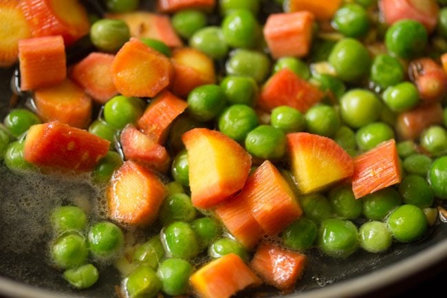 water added to carrots and green peas