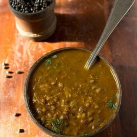 Punjabi maa ki dal served in a bowl with spoon in it