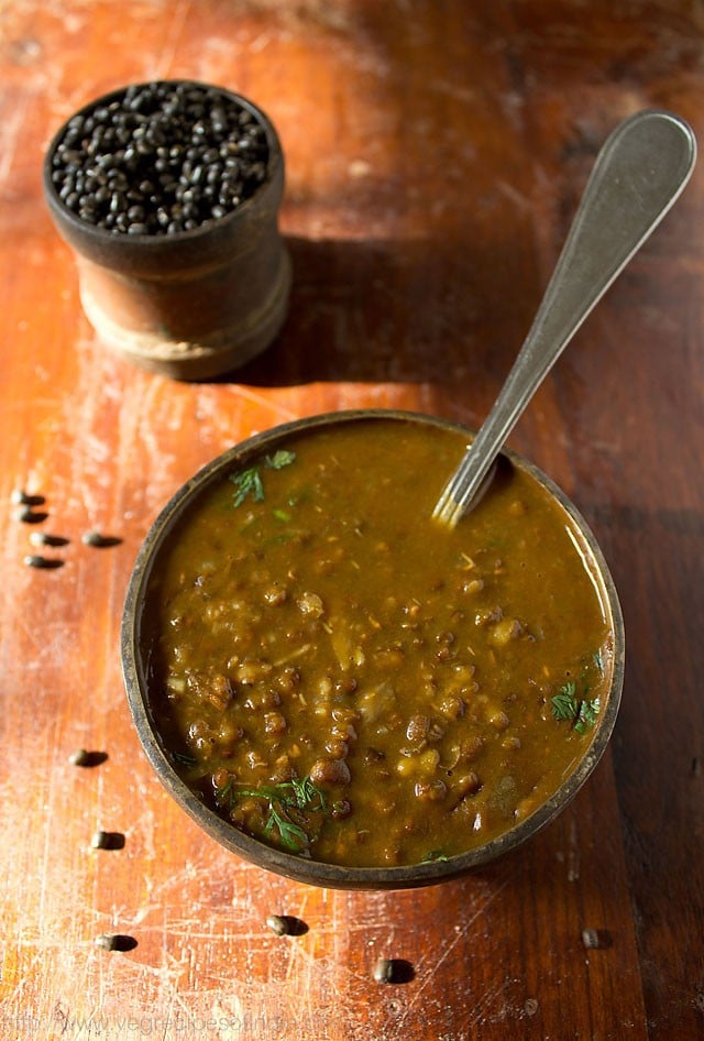 Punjabi maa ki dal served in a bowl with spoon in it