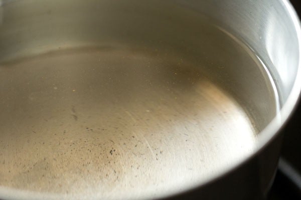 water and salt added to a pan.
