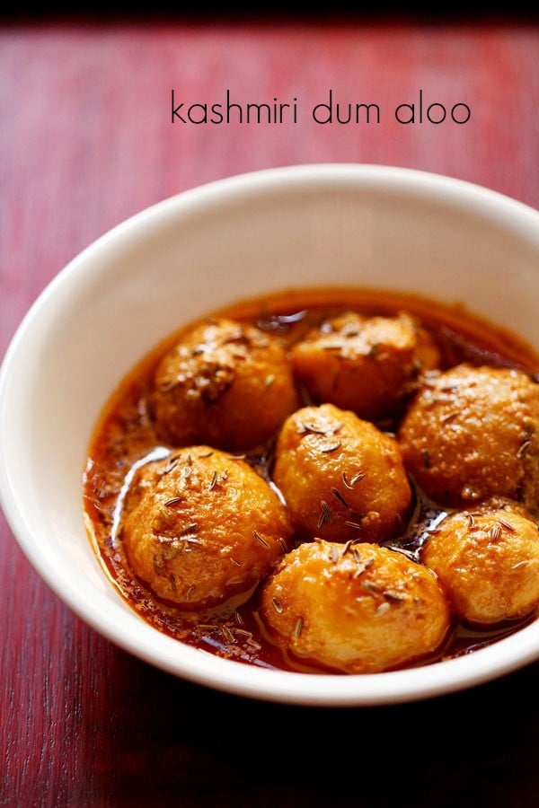 kashmiri dum aloo served in a white bowl.