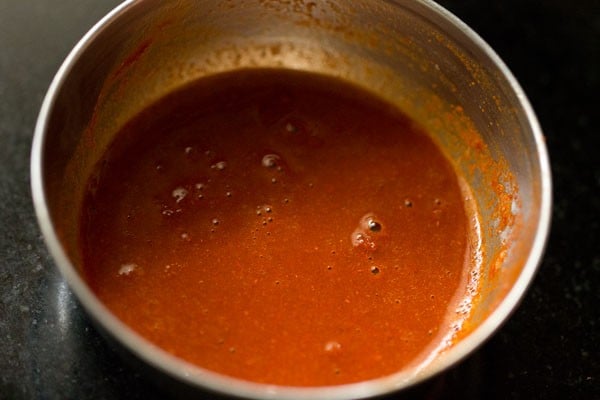 chili powder mixed well in the water.
