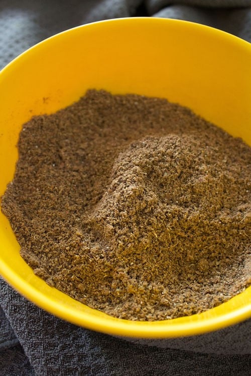 punjabi garam masala placed in a yellow bowl.