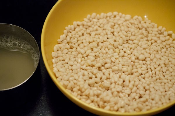 drained water from the urad dal and urad dal in a bowl