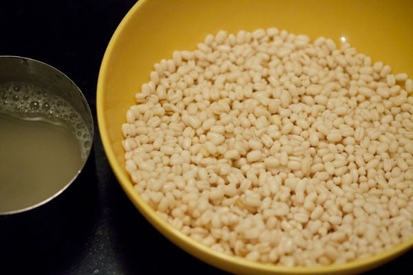 drained water from the urad dal and urad dal in a bowl