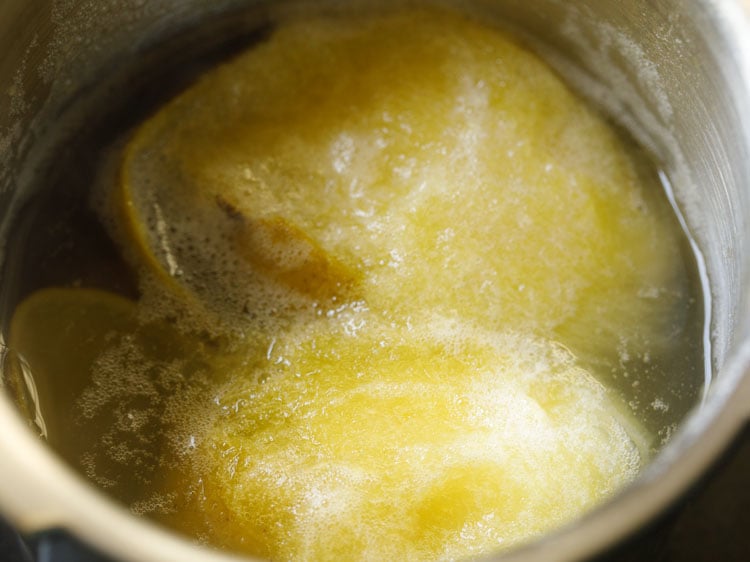 after cooking the mangoes, the skin should start to loosen and the pulp should be soft.