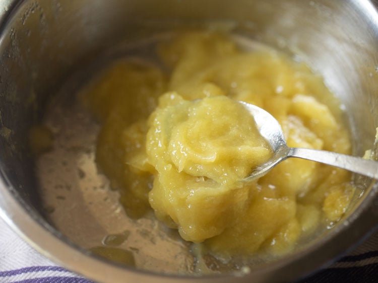 spoonful of green mango pulp after straining.