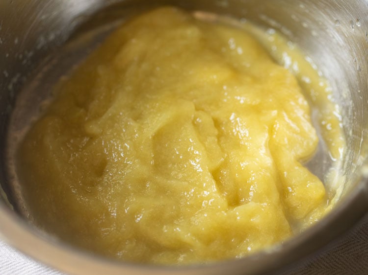 bowl of green mango pulp for making aam panna concentrate.