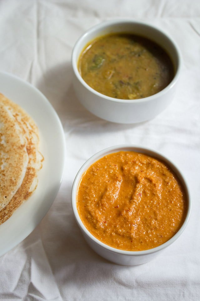til chutney served in a white bowl with dosa and sambar