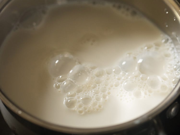heating whole milk in the pan. 