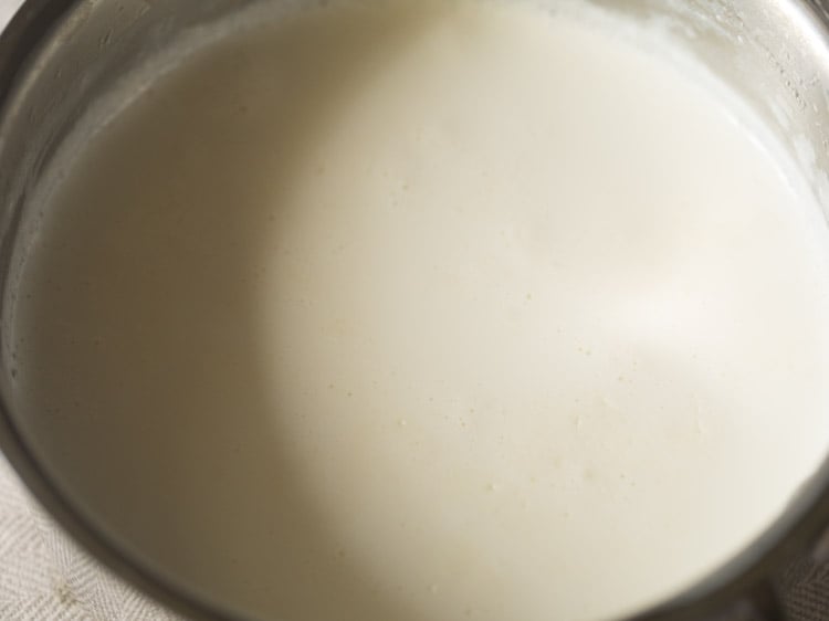 hot milk removed from the stovetop for dahi recipe.. 