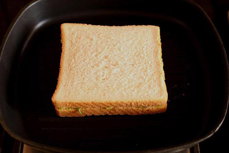 avocado sandwich placed on hot pan