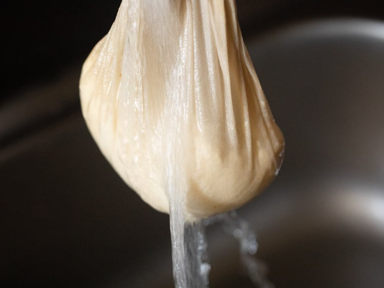 rinsing the muslin bundle in fresh water