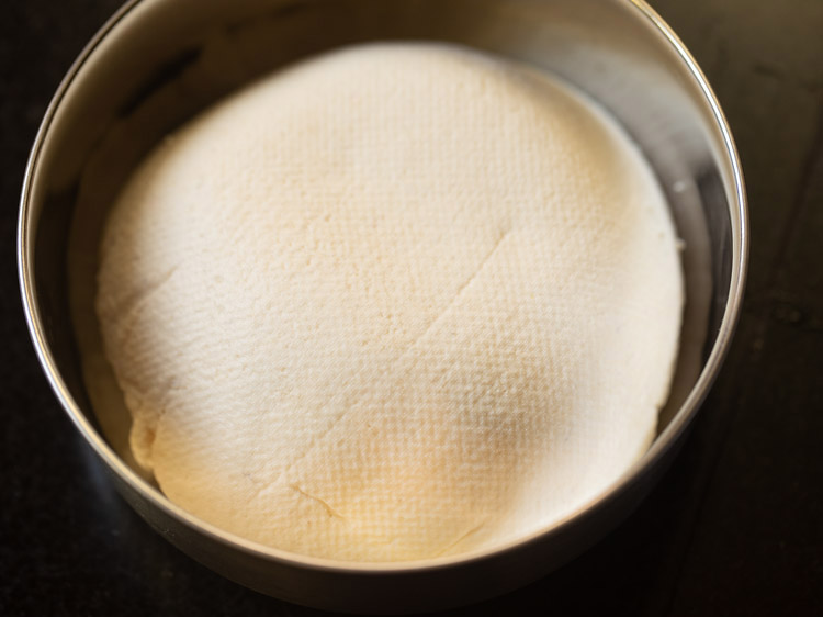 paneer cheese placed in a steel container