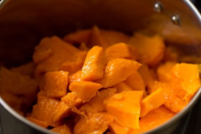 chopped alphonso mangoes in a blender