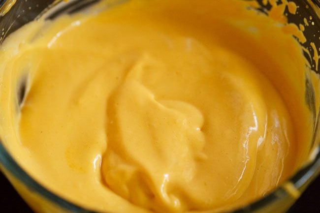 creamy mango mousse mixture in the bowl