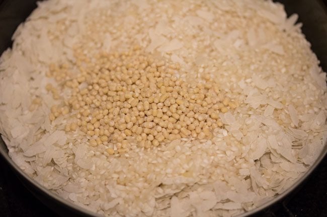 idli rice and poha and urad dal in a bowl