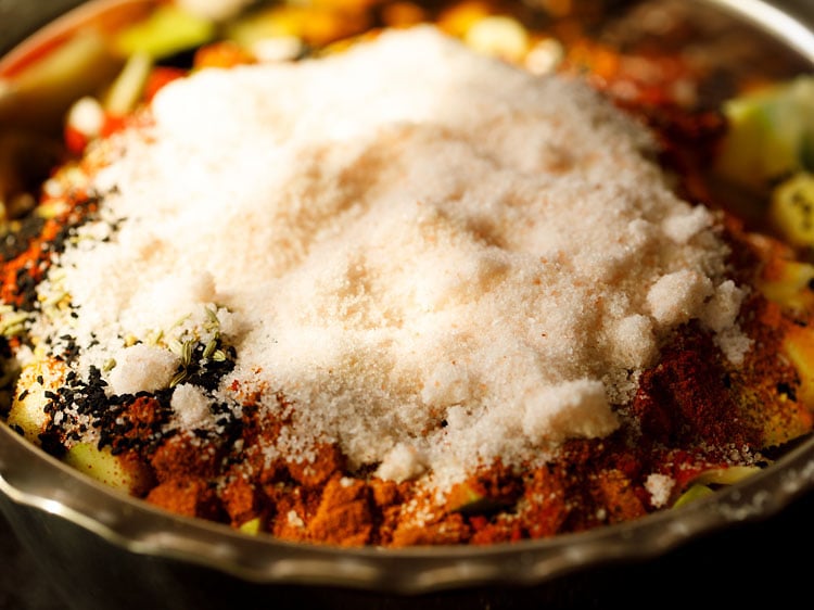 adding salt to the mango-spices mixture 