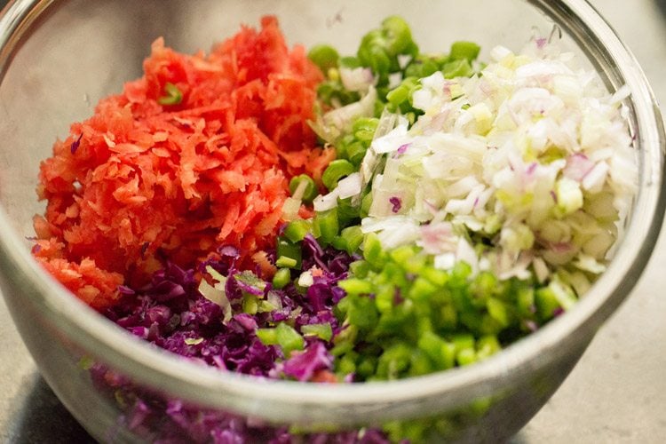 finely chopped or grated vegetables added in a bowl for making veg manchurian gravy.