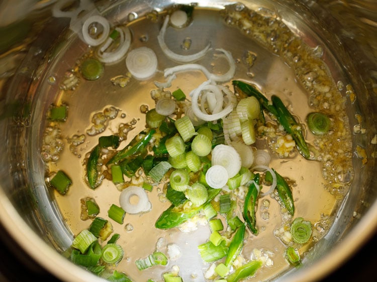 adding chopped scallions