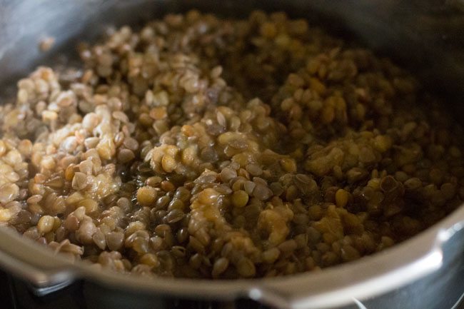 pressure cooked red lentils for making sabut masoor dal. 