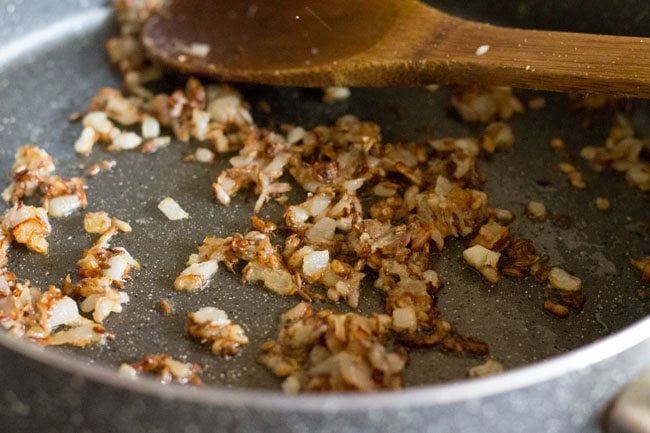 frying ginger-garlic paste for making sabut masoor dal. 