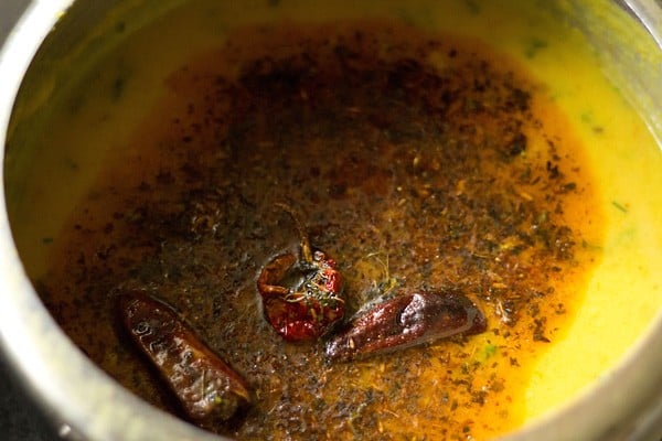 fried tempering ingredient added to the dal