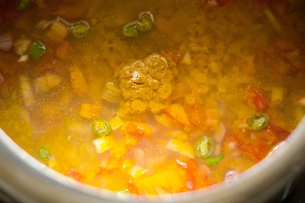 turmeric powder and asafoetida (hing) added in the pressure cooker