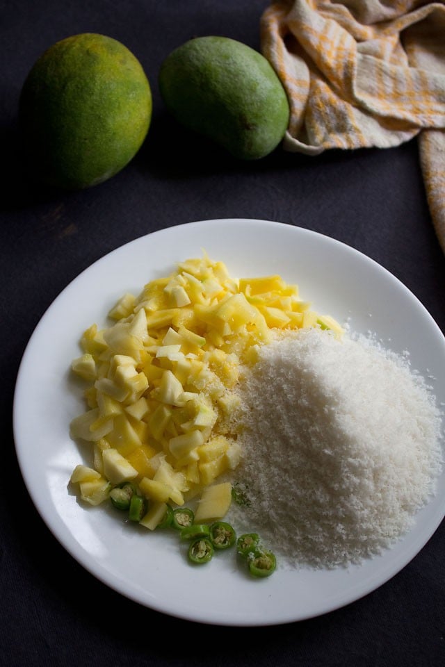 ingredients on a plate for green mango chutney. 