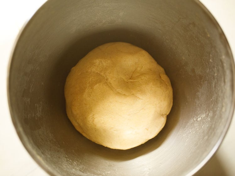 dough brushed with some water and kept in the same bowl