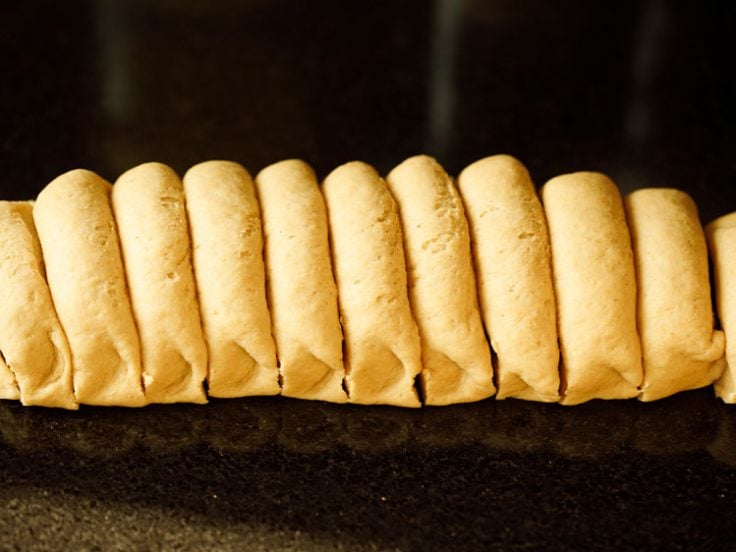 pita bread dough log sliced in equal portions