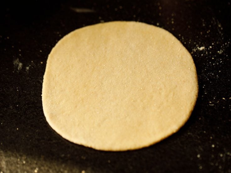 pita bread dough rolled to a 5 to 6 inches disc