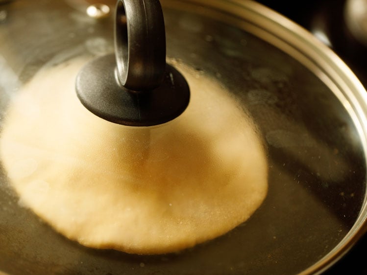 dough disc covered with a glass lid